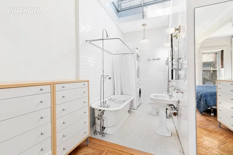 New York City Real Estate | View 323 Park Place | En-suite bath has clawfoot tub and laundry. | View 7