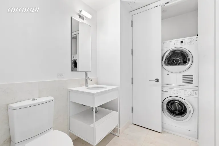 New York City Real Estate | View 241 Fifth Avenue, 11B | Bathroom with Washer/Dryer. | View 9