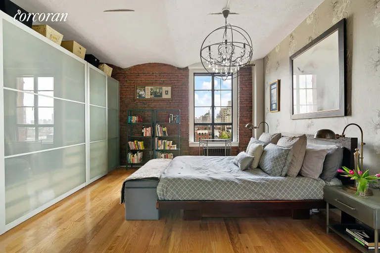 New York City Real Estate | View 720 Greenwich Street, 7A | Primary bedroom with brick detail | View 5