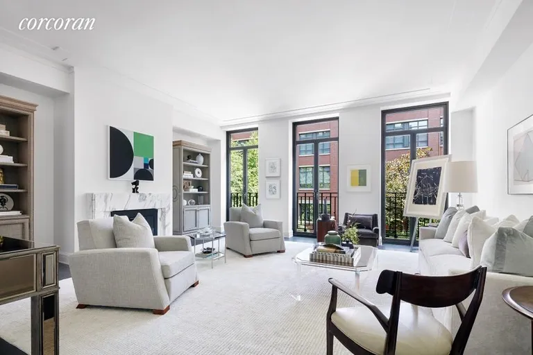 New York City Real Estate | View 145 West 11th Street, TH133 | Living Room with Gas Fireplace | View 4