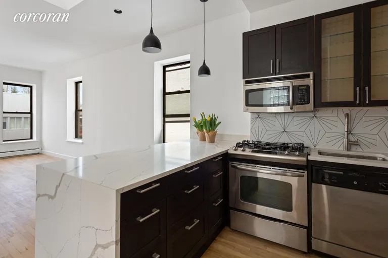 New York City Real Estate | View 99 Ave B, 6F | Waterfall quartz counters | View 5