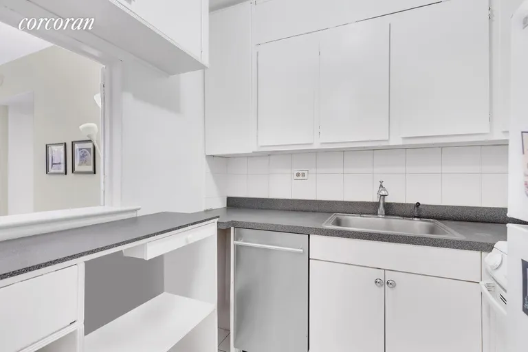 New York City Real Estate | View 200 East 28th Street, 3B | pass through kitchen.  Lots of cabinets | View 7