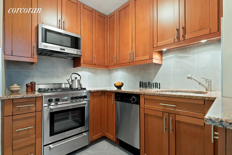 New York City Real Estate | View 400 East 85th Street, 5A | Renovated kitchen with cherry cabin | View 4