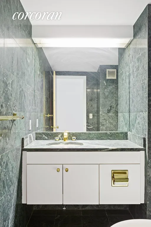 New York City Real Estate | View 188 East 70th Street, 8 | Powder room | View 6