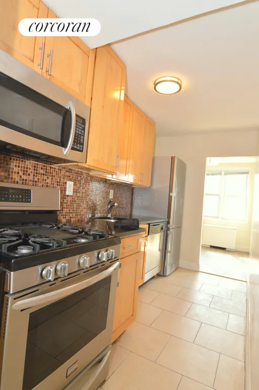 New York City Real Estate | View 201 East 36th Street, 15F | Pass through kitchen | View 3