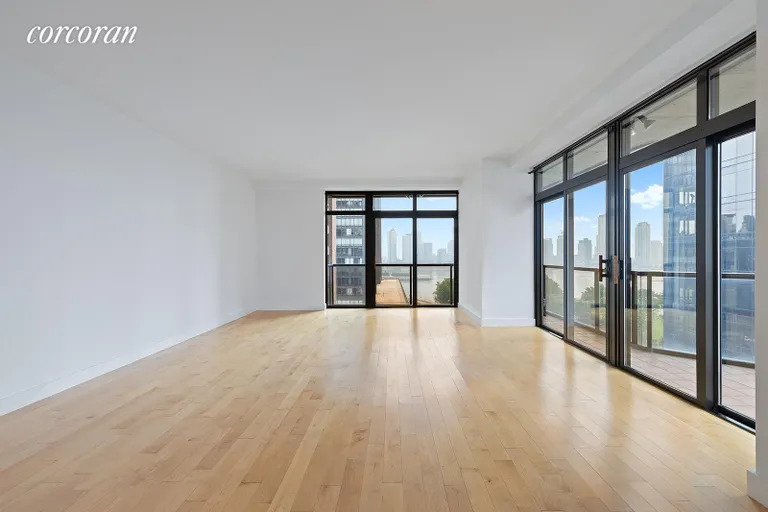New York City Real Estate | View 100 United Nations Plaza, 14B | Living room with direct East River | View 2