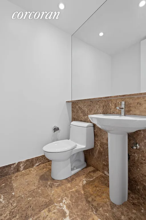 New York City Real Estate | View 100 United Nations Plaza, 14B | Renovated powder room | View 8