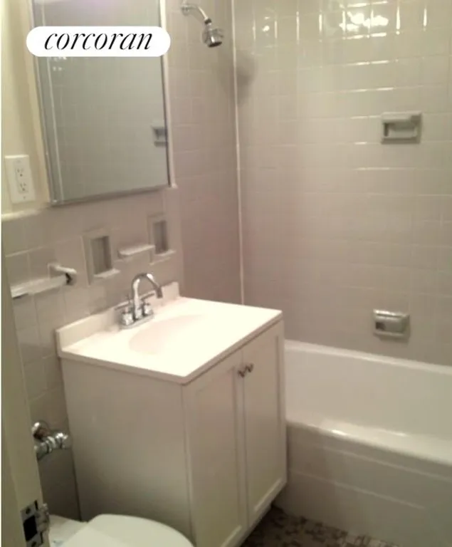 New York City Real Estate | View 77 West 55th Street, 2G | Tile Bath | View 6
