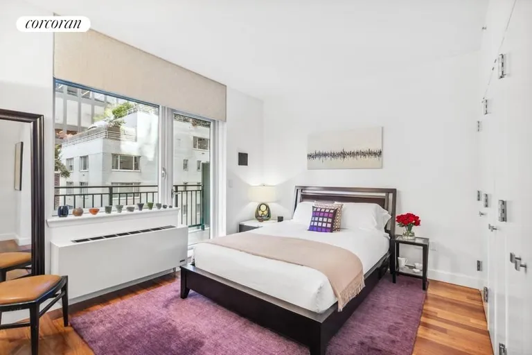 New York City Real Estate | View 212 East 57th Street, 8B | Bedroom with Balcony Access | View 5