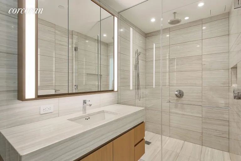 New York City Real Estate | View 50 West Street, 10B | Marble Bathroom | View 7