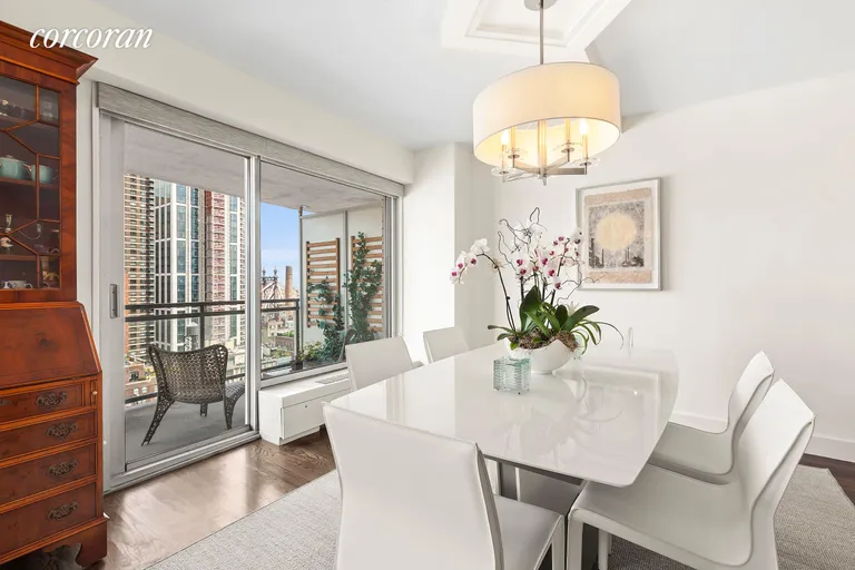 New York City Real Estate | View 400 East 56th Street, 28G | Dining Room Area and Balcony | View 5