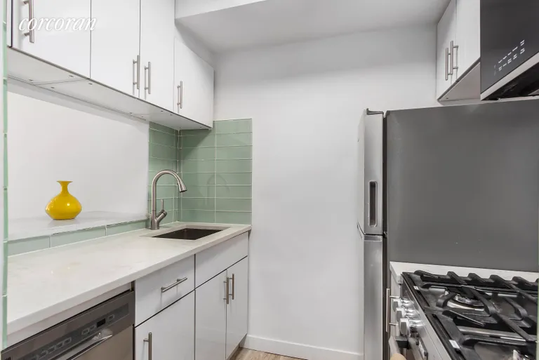 New York City Real Estate | View 25 West 13th Street, 4FS | Sleek kitchen with passthrough wind | View 3