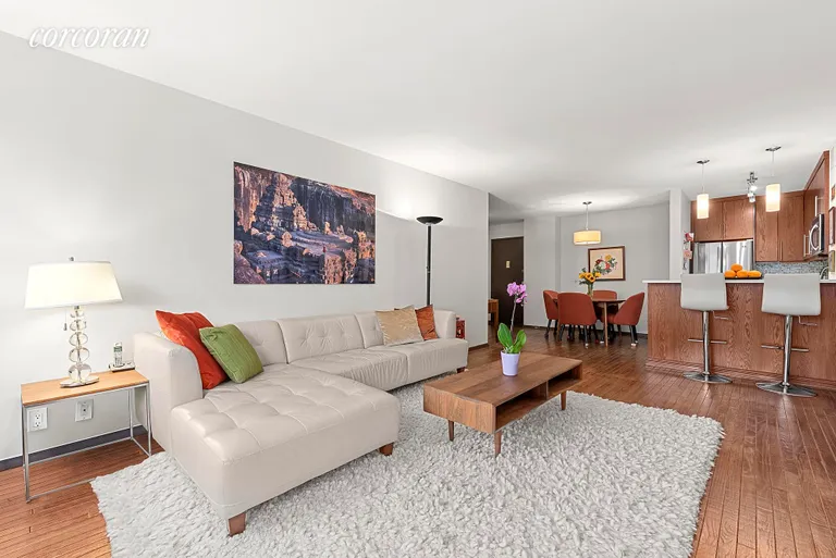 New York City Real Estate | View 211 West 71st Street, 11C | Living and Dining Area with Open Ki | View 3