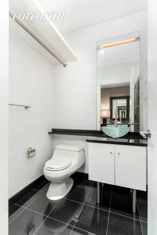New York City Real Estate | View 60 East 55th Street, 35A | Half Bathroom | View 6