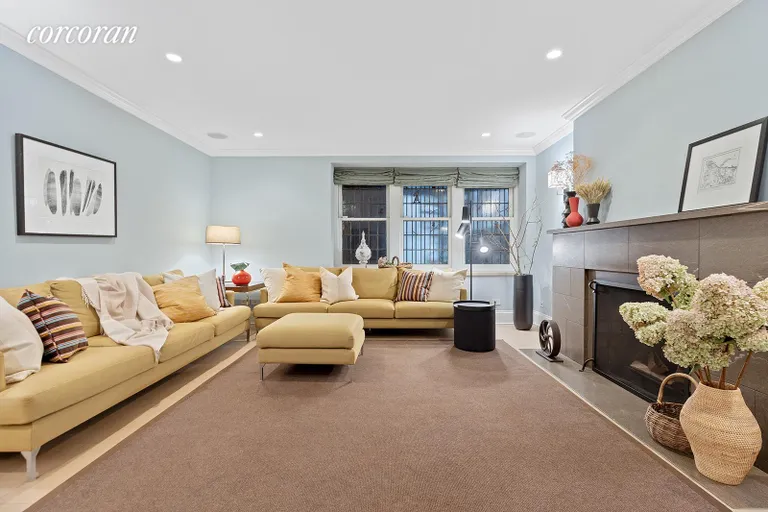 New York City Real Estate | View 20 Prospect Park West | Expansive media room with wood-burn | View 21