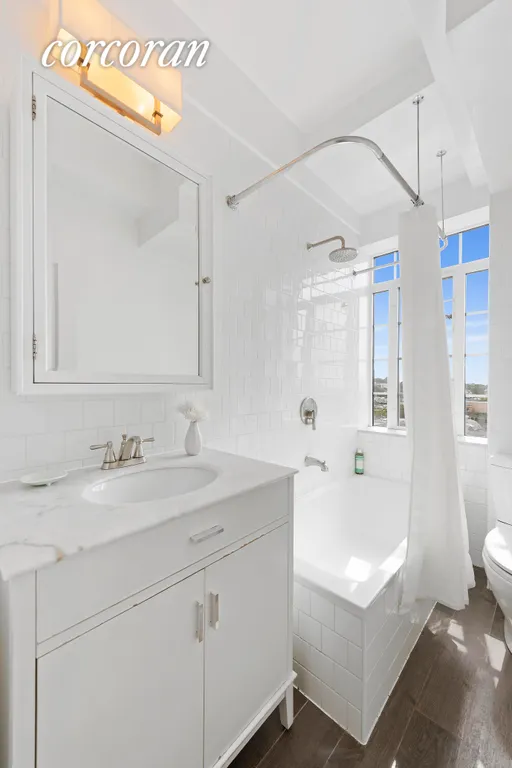 New York City Real Estate | View 118 8th Avenue, 10A | The windowed bathroom has a clean w | View 7