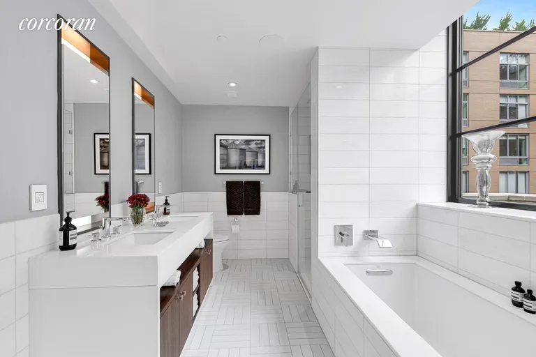New York City Real Estate | View 261 West 25th Street, 9C | Main Bathroom | View 12