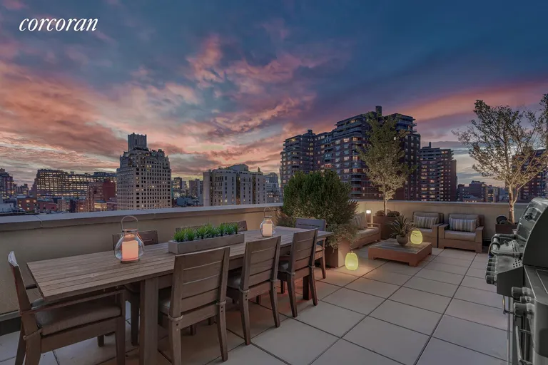 New York City Real Estate | View 261 West 25th Street, 9C | South Facing Terrace at Night | View 2