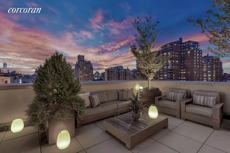 New York City Real Estate | View 261 West 25th Street, 9C | South Facing Terrace at Night | View 3