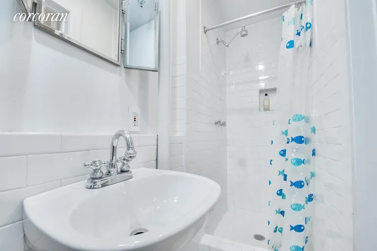 New York City Real Estate | View 133 West 28th Street, 5C | En Suite Bath off Bed 2 | View 11