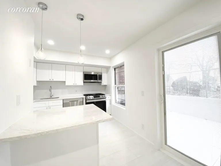 New York City Real Estate | View 151 Gates Avenue, B | Kitchen/Private Patio | View 3