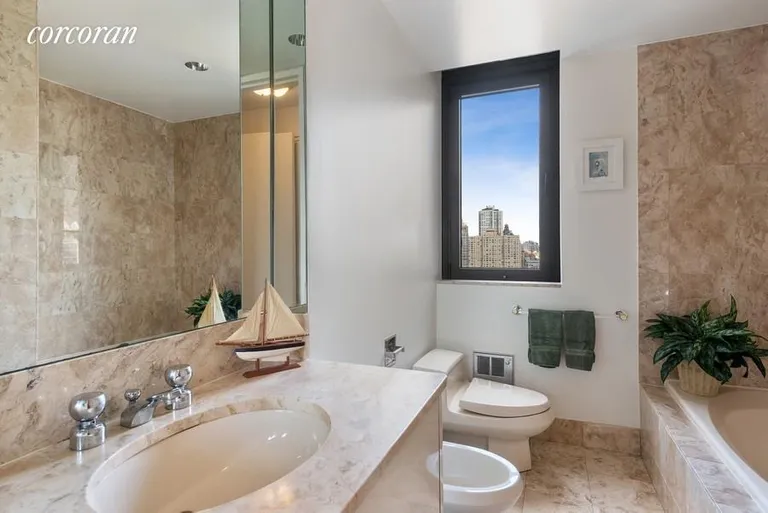 New York City Real Estate | View 100 United Nations Plaza, 29E | Windowed, en suite marble bathroom | View 8