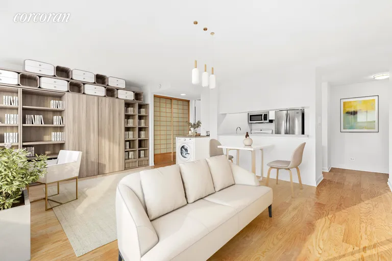 New York City Real Estate | View 236 East 47th Street, 27A | Living space with murphy bed | View 2