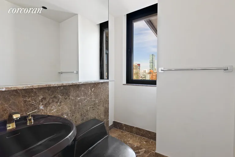 New York City Real Estate | View 100 United Nations Plaza, 34E | Windowed powder room | View 10
