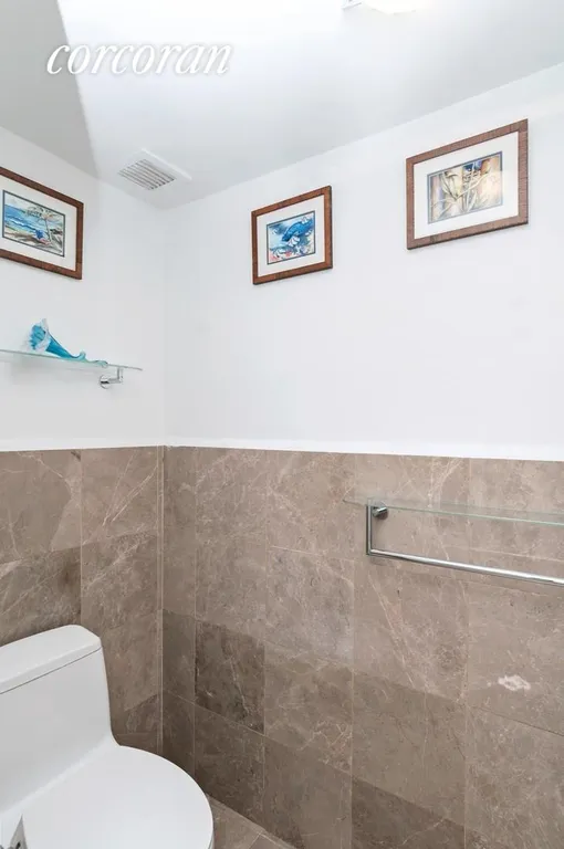 New York City Real Estate | View 340 East 64th Street, 12A | Half Bathroom | View 6