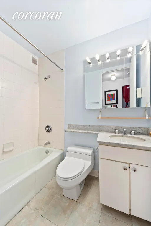 New York City Real Estate | View 393 West 49th Street, 4O | Primary Bathroom | View 4