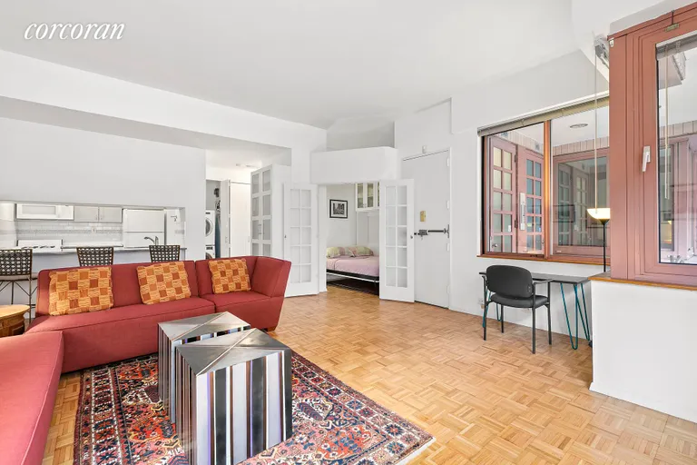 New York City Real Estate | View 393 West 49th Street, 1E | Living Room | View 2