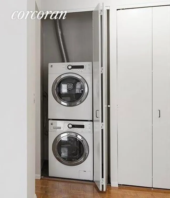 New York City Real Estate | View 393 West 49th Street, 1E | Laundry Room in Apt | View 6
