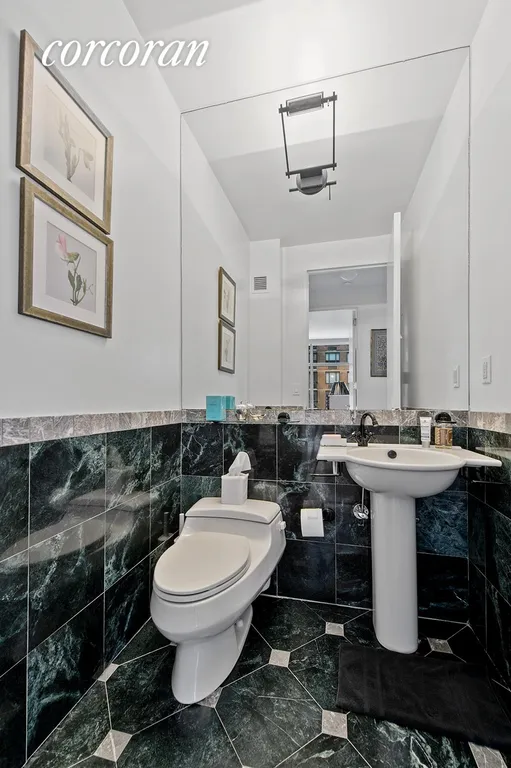 New York City Real Estate | View 250 East 54th Street, 18D | Half Bathroom | View 6