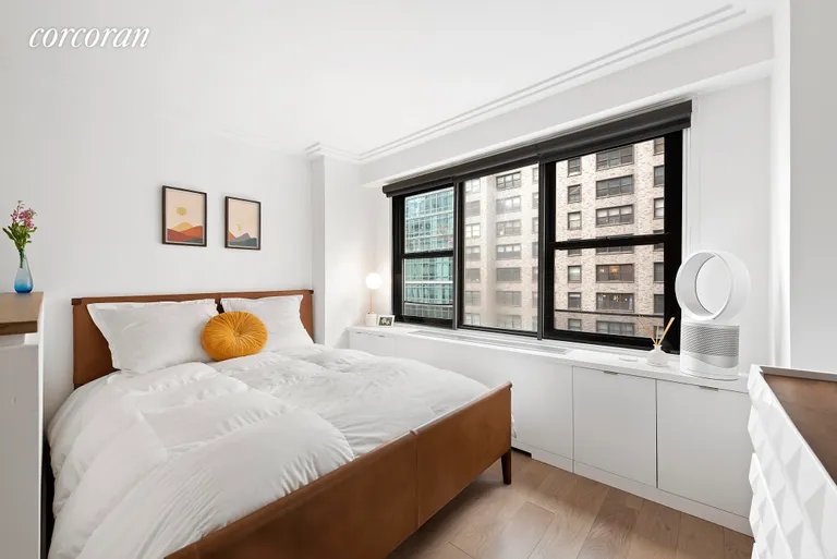 New York City Real Estate | View 220 East 57th Street, 10E | Sleeping area with privacy wall | View 3