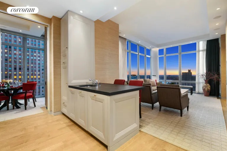 New York City Real Estate | View 310 West 52Nd Street, 29B | Evening - Living/Dining | View 4