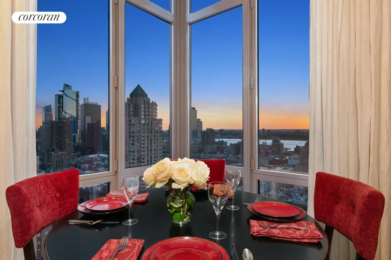 New York City Real Estate | View 310 West 52Nd Street, 29B | Evening - Dining Area | View 8