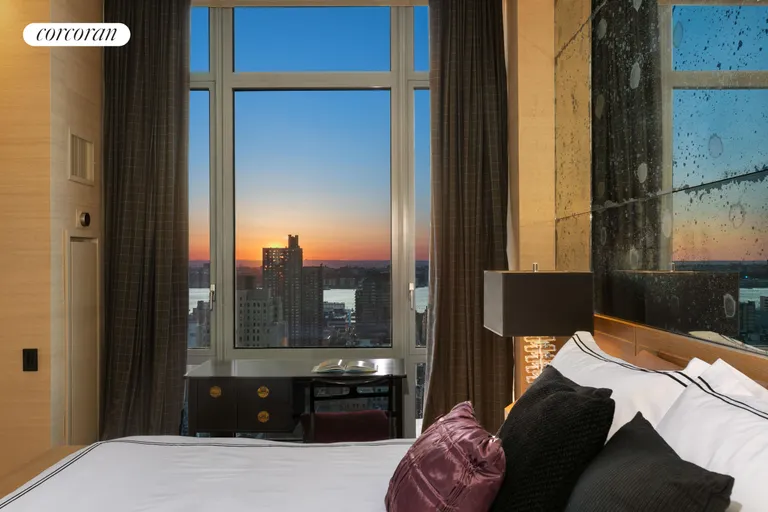 New York City Real Estate | View 310 West 52Nd Street, 29B | Evening - Primary Bedroom | View 12