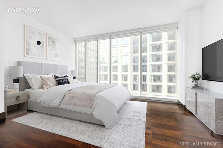 New York City Real Estate | View 151 East 85th Street, 8F | Virtually staged primary bedroom | View 3