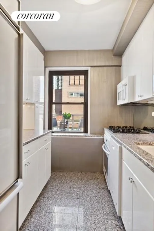 New York City Real Estate | View 50 Sutton Place South, 21F | Kitchen Overlooking North Terrace | View 9