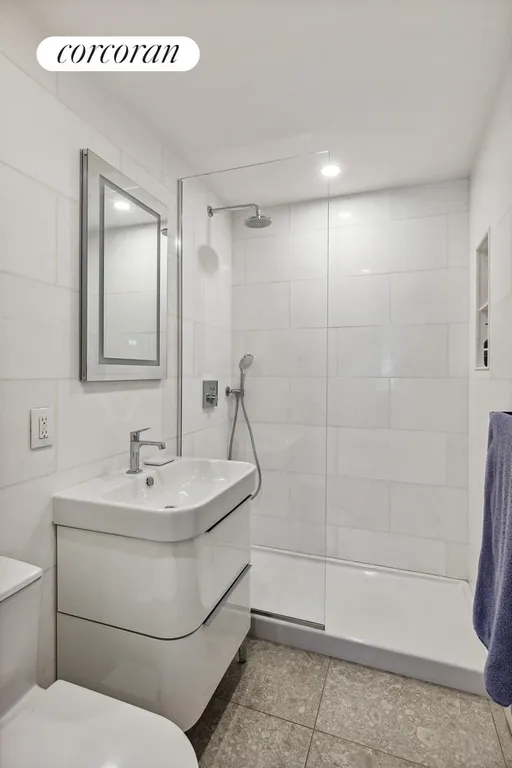 New York City Real Estate | View 115 East 9th Street, 2F | Primary Bathroom | View 8