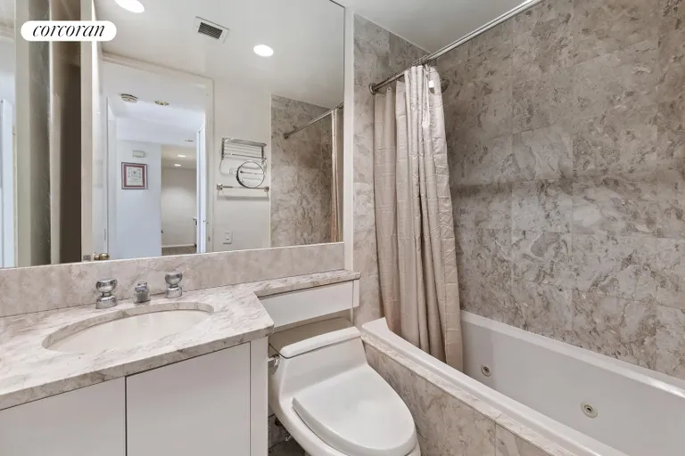 New York City Real Estate | View 100 United Nations Plaza, 20D | Marble bathroom | View 4