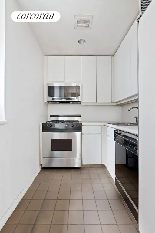 New York City Real Estate | View 100 United Nations Plaza, 9EF | Windowed kitchen | View 3