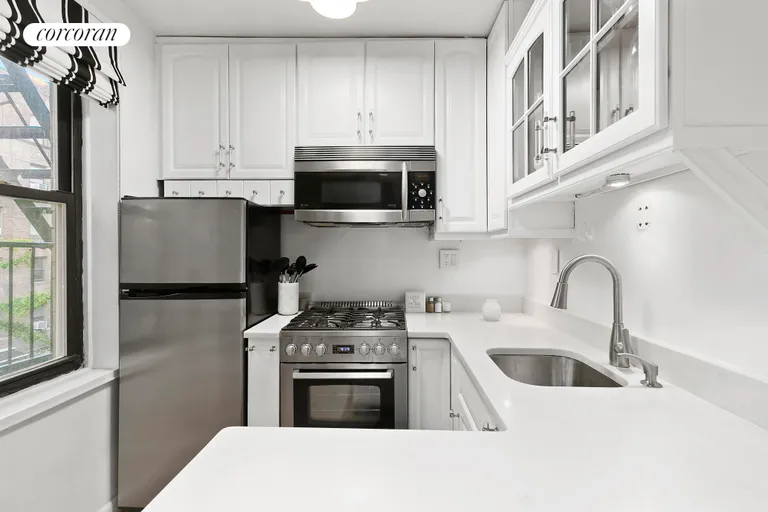 New York City Real Estate | View 342 East 53rd Street, 3B | Windowed Kitchen has Great Storage | View 3
