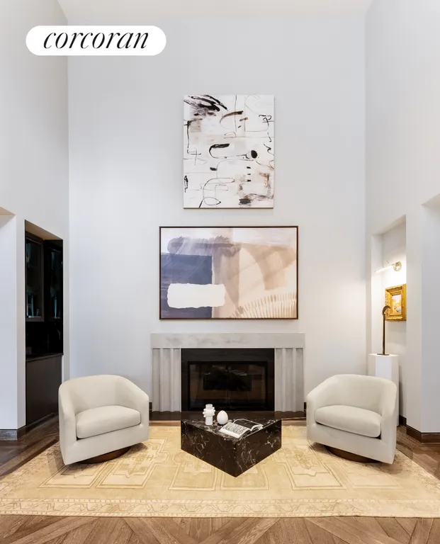 New York City Real Estate | View 111 West 57th Street, 14N | Living Room with Fireplace | View 2
