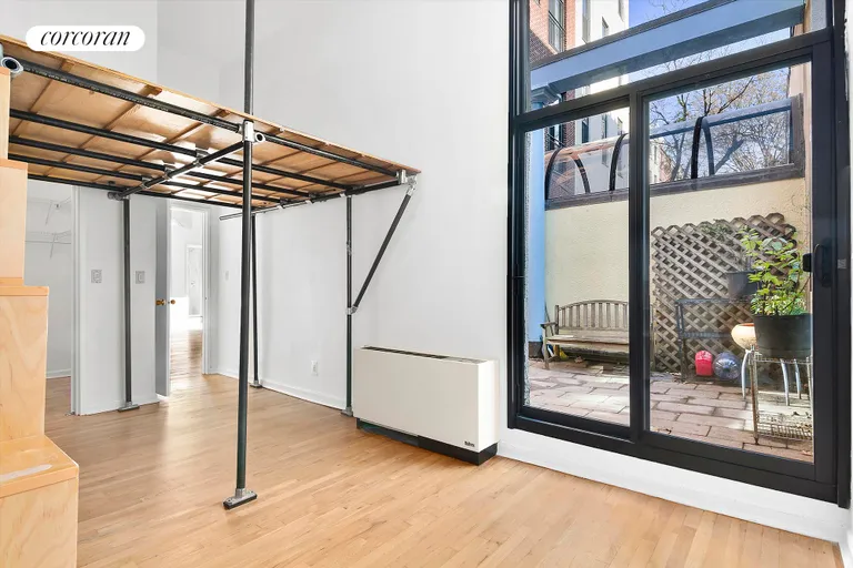 New York City Real Estate | View 121 Pacific Street, A1G | Bedroom with access to patio | View 7
