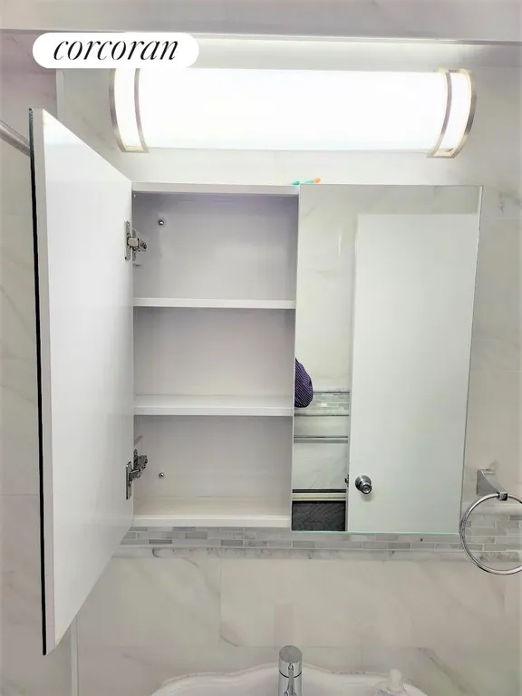 New York City Real Estate | View 2102 Holland Avenue, 1D | Beautiful Medicine Cabinet Mirror | View 13