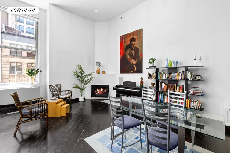New York City Real Estate | View 121 West 20th Street, 4F | Fireplace and Dining Area | View 4