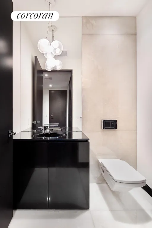 New York City Real Estate | View 157 West 57th Street, 56C | Half Bathroom | View 13