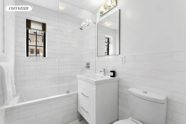 New York City Real Estate | View 201 West 16th Street, 18D | Spa-Like Marble Bath | View 6