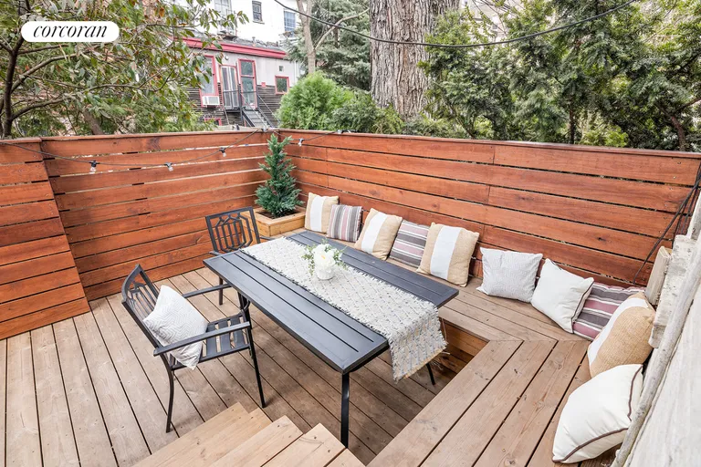 New York City Real Estate | View 225 Baltic Street, 1R | Rear deck with built-in benches | View 2